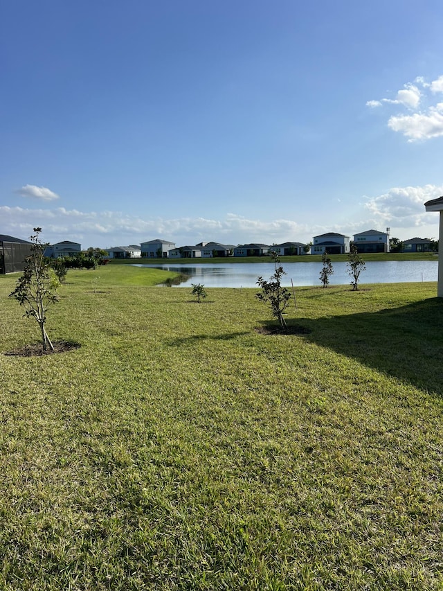 10574 SW Jem St, Port Saint Lucie, FL 34987 - view of green lawn with a water view