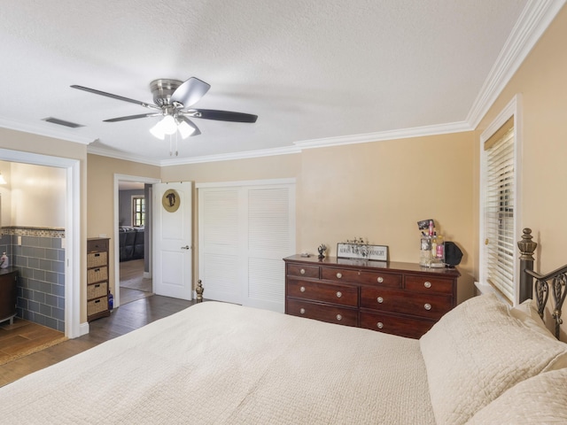 1155 Woodcrest Rd W, West Palm Beach, FL 33417 - bedroom with a closet, crown molding, wood finished floors, a ceiling fan, and a textured ceiling