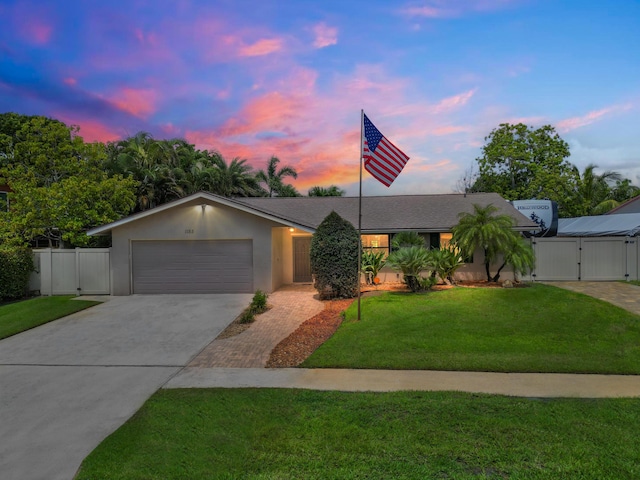 1155 Woodcrest Rd W, West Palm Beach, FL 33417 - view of front of house featuring a gate, driveway, and an attached garage