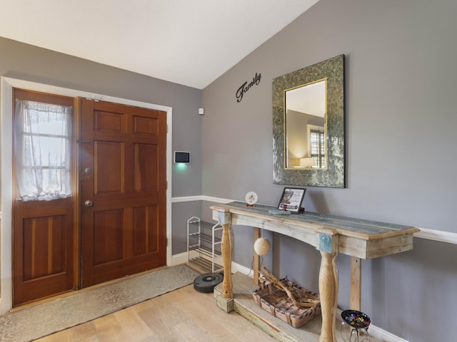 1155 Woodcrest Rd W, West Palm Beach, FL 33417 - entrance foyer with wood finished floors and lofted ceiling