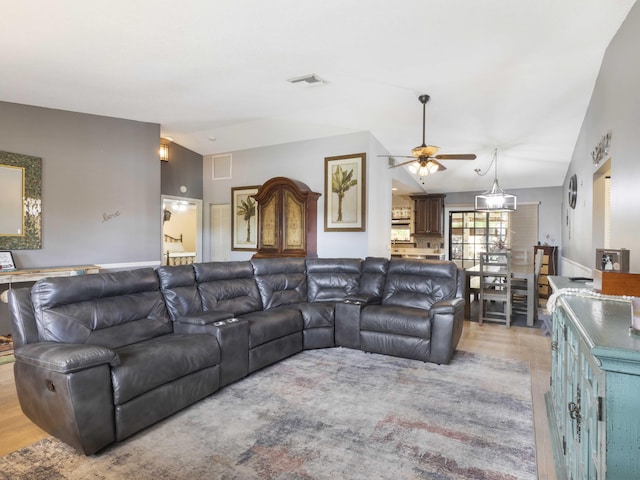 1155 Woodcrest Rd W, West Palm Beach, FL 33417 - living area featuring vaulted ceiling, ceiling fan, and light wood-type flooring