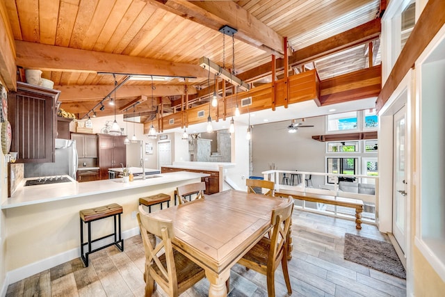 1819 SW Crane Crk, Palm City, FL 34990 - dining room with a wooden ceiling with exposed beams, light wood-style floors, and ceiling fan