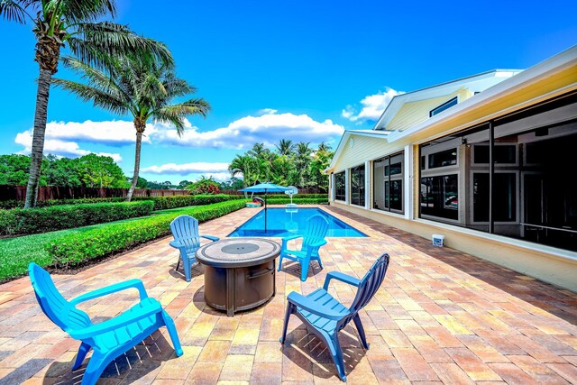 1819 SW Crane Crk, Palm City, FL 34990 - outdoor pool with a patio area and a fire pit