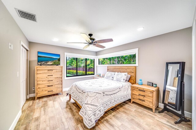 1819 SW Crane Crk, Palm City, FL 34990 - bedroom featuring light wood-style flooring, a ceiling fan, and recessed lighting