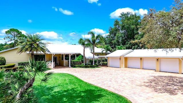 1819 SW Crane Crk, Palm City, FL 34990 - ranch-style home with driveway, a front lawn, and a garage
