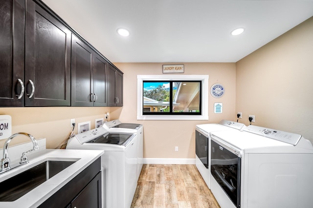 1819 SW Crane Crk, Palm City, FL 34990 - washroom with washer and clothes dryer, cabinet space, light wood-type flooring, and recessed lighting