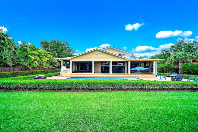1819 SW Crane Crk, Palm City, FL 34990 - rear view of property with a sunroom and a patio area