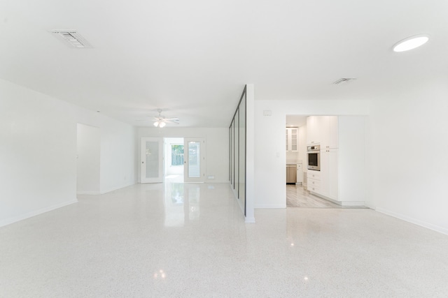 450 NE 38th St, Boca Raton, FL 33431 - unfurnished room with ceiling fan and dark aggregate flooring