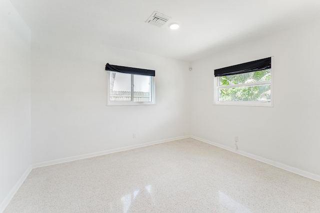 450 NE 38th St, Boca Raton, FL 33431 - unfurnished room with speckled floor and baseboards