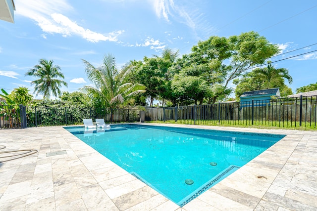 450 NE 38th St, Boca Raton, FL 33431 - view of pool with a patio and a fenced backyard
