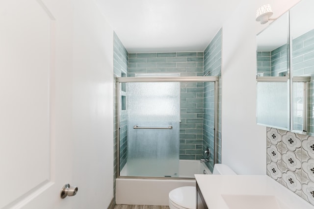 450 NE 38th St, Boca Raton, FL 33431 - bathroom featuring vanity, shower / bath combination with glass door, and wood finished floors