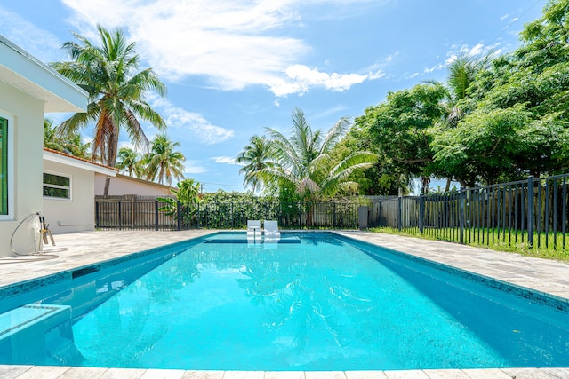 450 NE 38th St, Boca Raton, FL 33431 - view of pool featuring a fenced backyard and a patio area