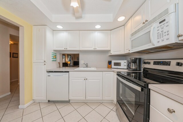 230 NE 26th Ave Unit 213, Boynton Beach, FL 33435 - kitchen featuring white appliances, a ceiling fan, light countertops, light tile patterned floors, and recessed lighting