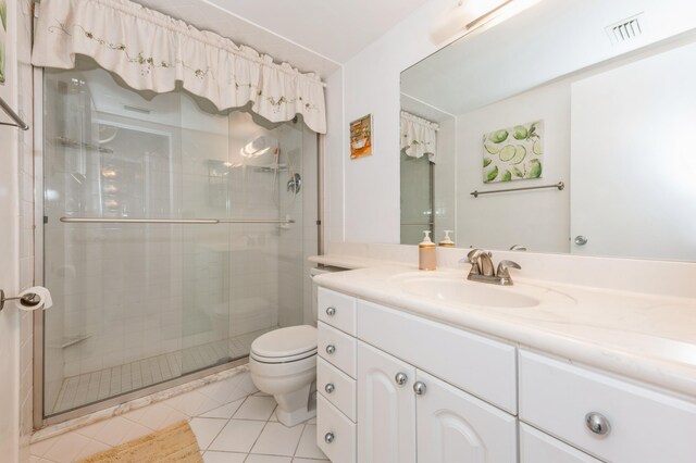 230 NE 26th Ave Unit 213, Boynton Beach, FL 33435 - bedroom featuring light tile patterned floors and ceiling fan