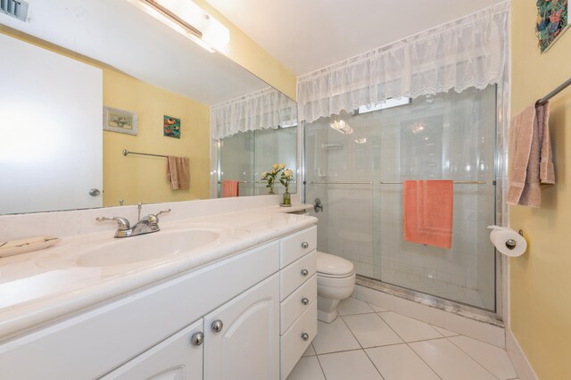 230 NE 26th Ave Unit 213, Boynton Beach, FL 33435 - full bath featuring vanity, tile patterned floors, and a stall shower
