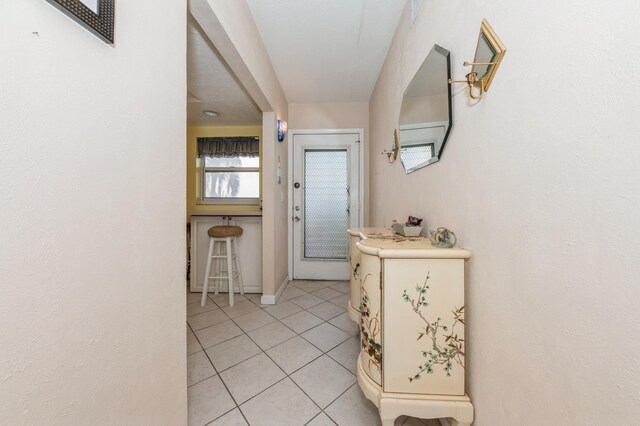 230 NE 26th Ave Unit 213, Boynton Beach, FL 33435 - bedroom with ceiling fan and light tile patterned floors