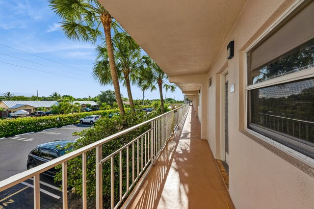 230 NE 26th Ave Unit 213, Boynton Beach, FL 33435 - full bathroom with vanity, tile patterned flooring, and a shower stall