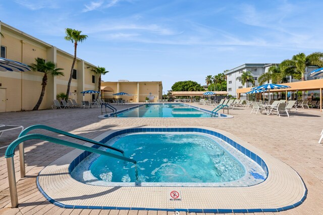 230 NE 26th Ave Unit 213, Boynton Beach, FL 33435 - community pool with a patio area