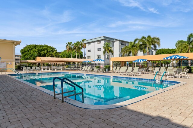 230 NE 26th Ave Unit 213, Boynton Beach, FL 33435 - view of home's community featuring shuffleboard and uncovered parking
