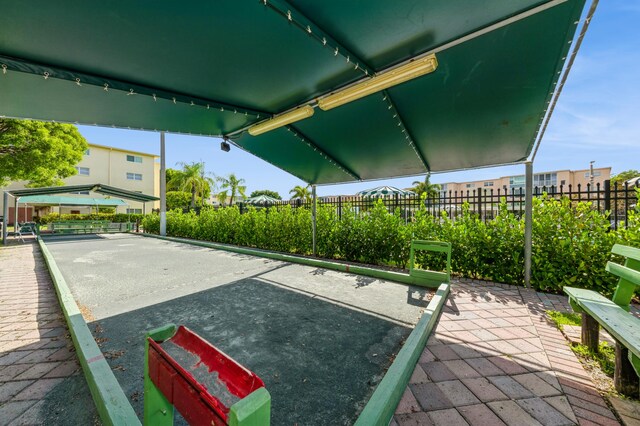 230 NE 26th Ave Unit 213, Boynton Beach, FL 33435 - community pool with a patio area, a community hot tub, and a residential view