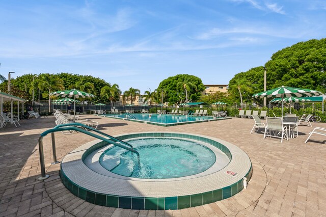 230 NE 26th Ave Unit 213, Boynton Beach, FL 33435 - community pool with a patio area