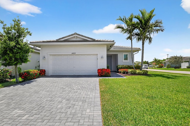 14929 Three Ponds Trl, Delray Beach, FL 33446 - ranch-style home featuring a front lawn, decorative driveway, and an attached garage