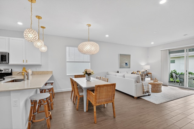 14929 Three Ponds Trl, Delray Beach, FL 33446 - dining room featuring wood finished floors and recessed lighting