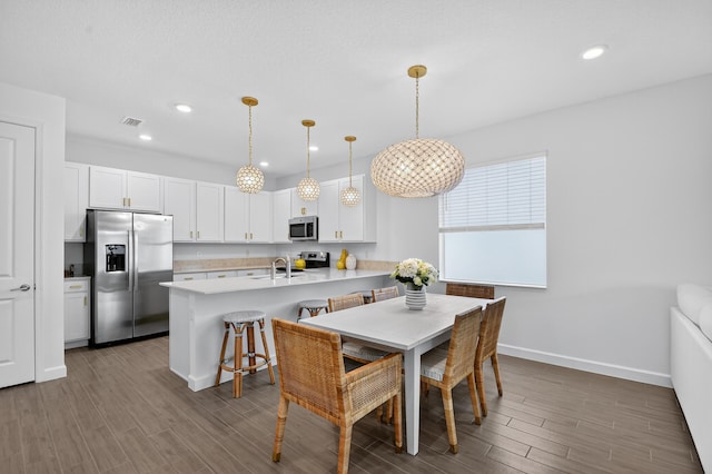14929 Three Ponds Trl, Delray Beach, FL 33446 - dining room with dark wood-style flooring and recessed lighting