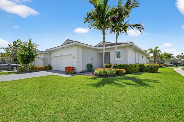 14929 Three Ponds Trl, Delray Beach, FL 33446 - single story home with stucco siding, a front yard, driveway, and an attached garage