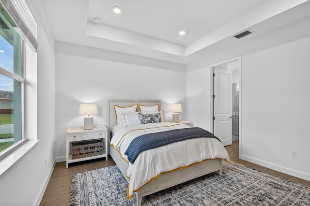 14929 Three Ponds Trl, Delray Beach, FL 33446 - bedroom featuring multiple windows, wood finished floors, recessed lighting, and a raised ceiling