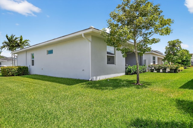 14929 Three Ponds Trl, Delray Beach, FL 33446 - view of side of property featuring stucco siding and a yard