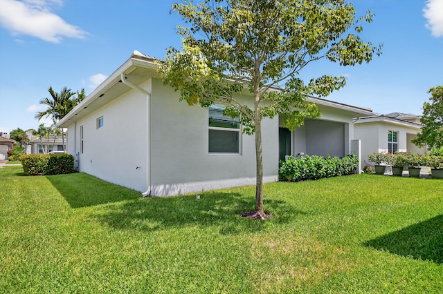 14929 Three Ponds Trl, Delray Beach, FL 33446 - view of side of home featuring stucco siding and a lawn