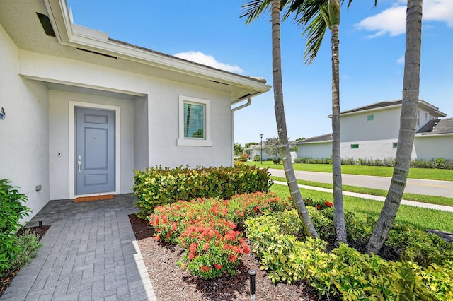 14929 Three Ponds Trl, Delray Beach, FL 33446 - view of exterior entry with stucco siding