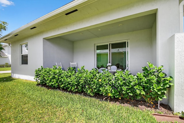 14929 Three Ponds Trl, Delray Beach, FL 33446 - view of home's exterior with a lawn and stucco siding