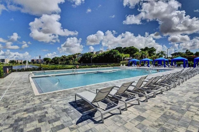 14929 Three Ponds Trl, Delray Beach, FL 33446 - community pool with a patio