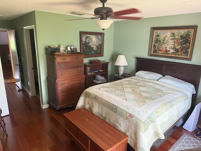 1131 SW 87th Ave, Pembroke Pines, FL 33025 - bedroom featuring dark wood-type flooring, a textured ceiling, and a ceiling fan