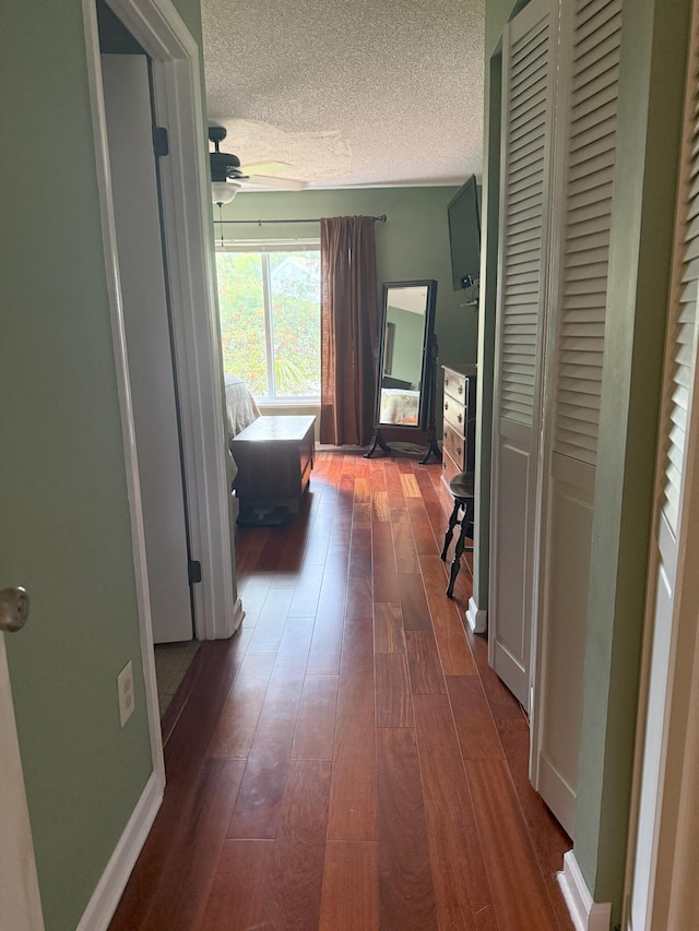 1131 SW 87th Ave, Pembroke Pines, FL 33025 - corridor with dark wood finished floors and a textured ceiling