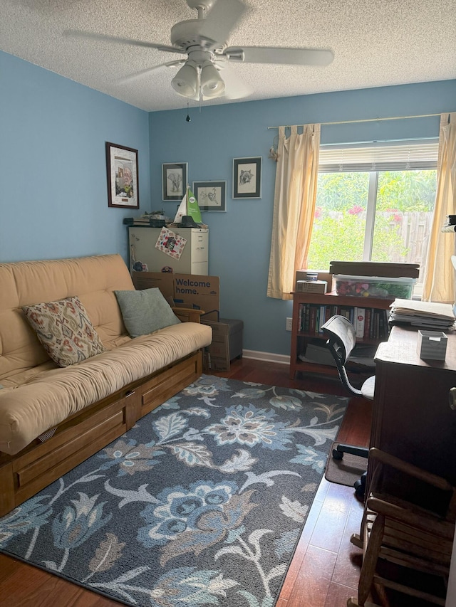 1131 SW 87th Ave, Pembroke Pines, FL 33025 - living area with wood finished floors, a ceiling fan, and a textured ceiling