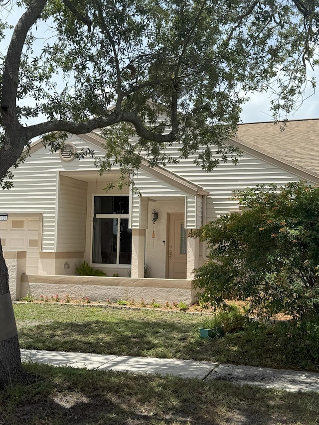 1131 SW 87th Ave, Pembroke Pines, FL 33025 - view of exterior entry with an attached garage