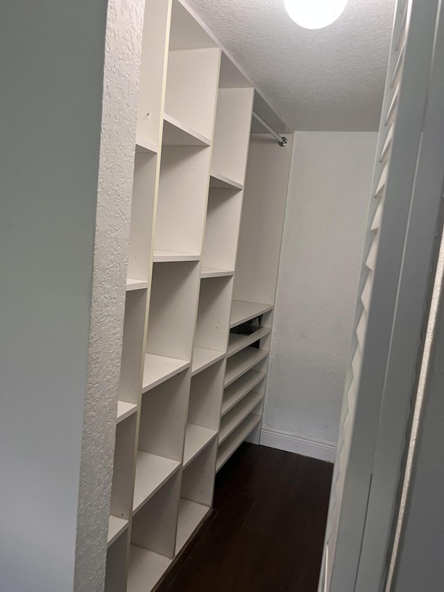 9467 Boca Cove Cir Unit 804, Boca Raton, FL 33428 - walk in closet with dark wood-type flooring