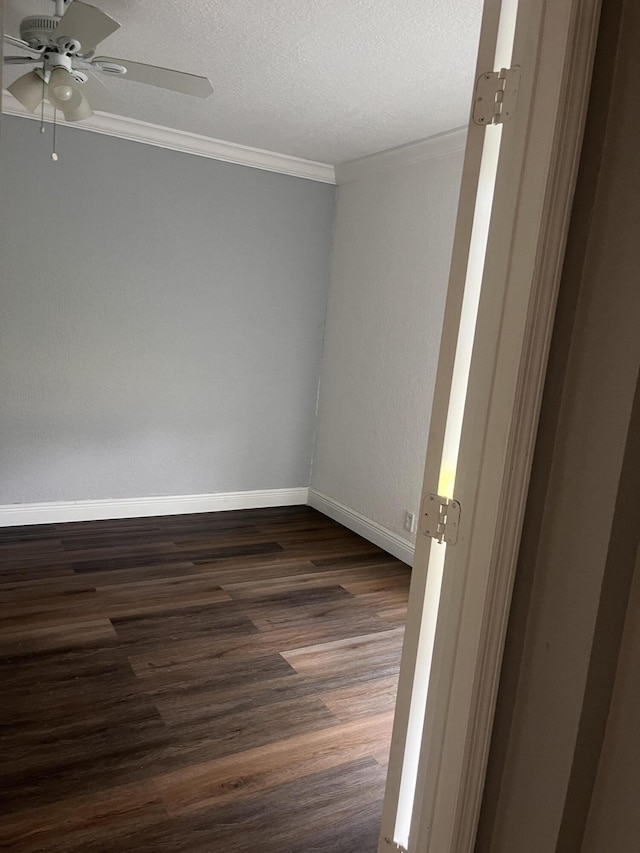9467 Boca Cove Cir Unit 804, Boca Raton, FL 33428 - empty room with ceiling fan, dark wood-style floors, ornamental molding, and a textured ceiling