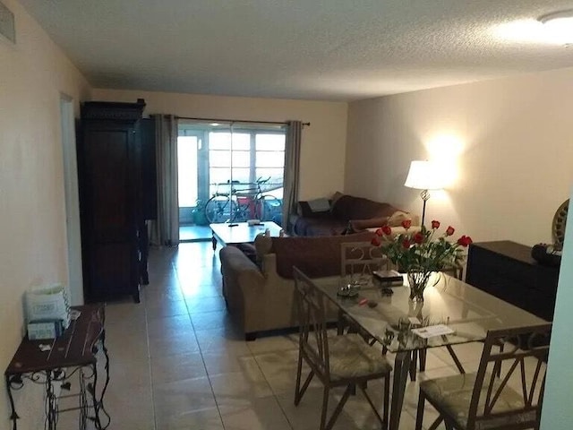 2800 Fiore Way Unit 108, Delray Beach, FL 33445 - dining room featuring a textured ceiling and light tile patterned floors