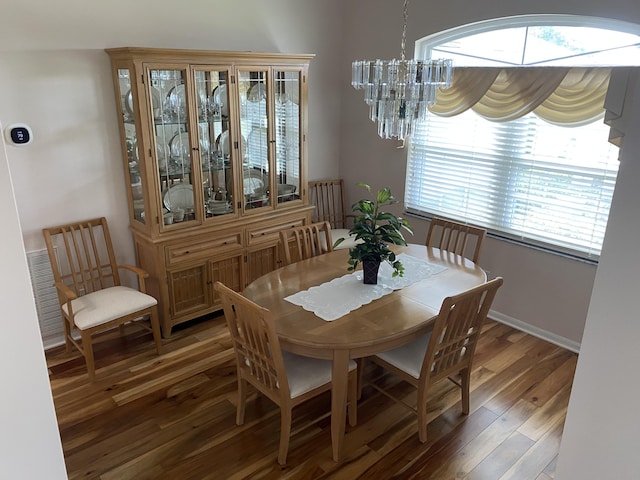 3053 SE Darien Rd, Port Saint Lucie, FL 34952 - dining space with healthy amount of natural light, a chandelier, and wood finished floors