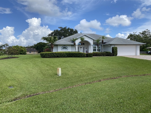 3053 SE Darien Rd, Port Saint Lucie, FL 34952 - single story home featuring driveway, a garage, a front yard, and stucco siding