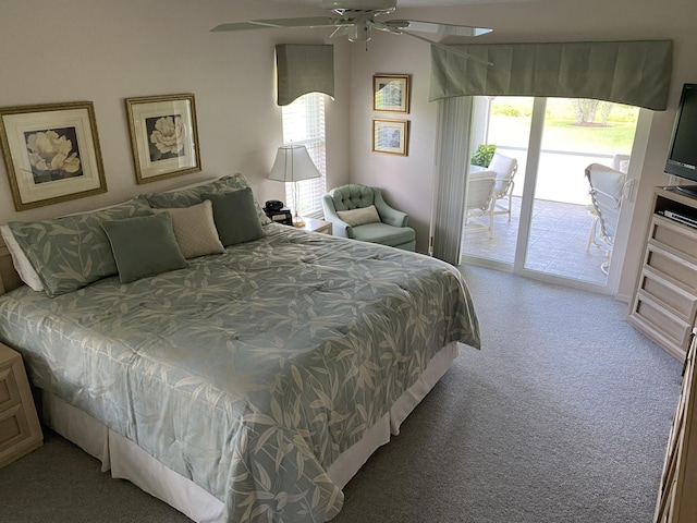 3053 SE Darien Rd, Port Saint Lucie, FL 34952 - bedroom with access to outside, multiple windows, light carpet, and ceiling fan