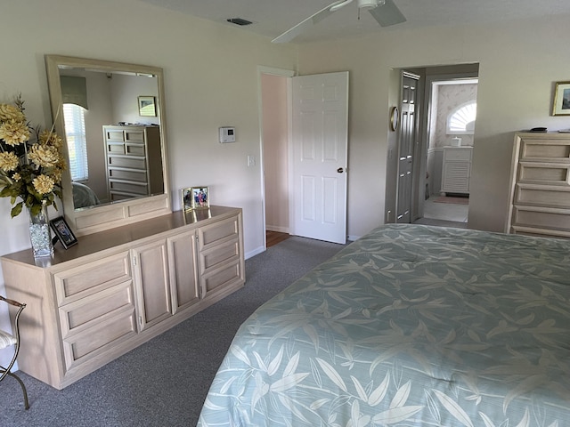 3053 SE Darien Rd, Port Saint Lucie, FL 34952 - bedroom with dark colored carpet and connected bathroom