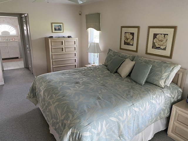3053 SE Darien Rd, Port Saint Lucie, FL 34952 - carpeted bedroom featuring ensuite bath
