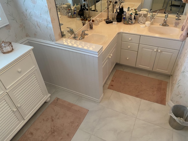 3053 SE Darien Rd, Port Saint Lucie, FL 34952 - full bath with wallpapered walls, double vanity, and tile patterned flooring