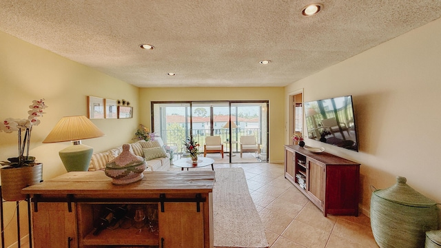 4090 Tivoli Ct Unit 303, Lake Worth, FL 33467 - living area featuring light tile patterned floors, recessed lighting, and a textured ceiling