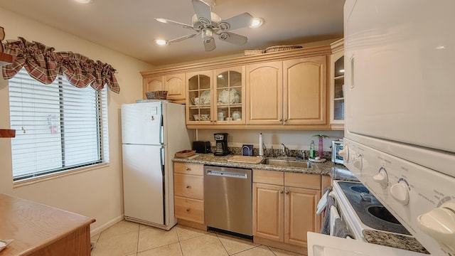 4090 Tivoli Ct Unit 303, Lake Worth, FL 33467 - kitchen featuring dishwasher, freestanding refrigerator, light brown cabinets, light tile patterned floors, and recessed lighting